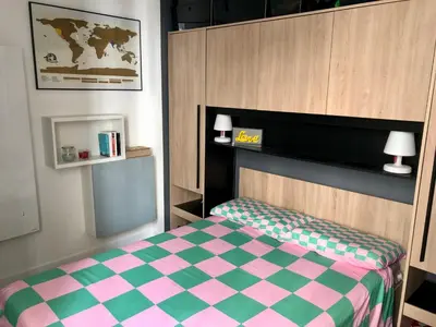 Un ou plusieurs lits dans un hébergement de l'établissement Appartement Paris Alésia Montparnasse