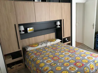 Un ou plusieurs lits dans un hébergement de l'établissement Appartement Paris Alésia Montparnasse