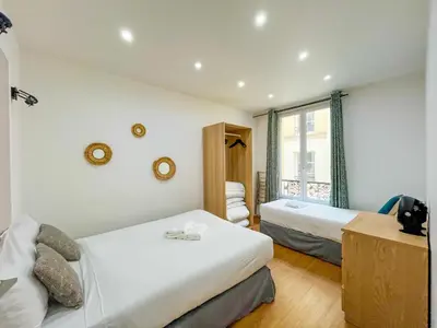 Un ou plusieurs lits dans un hébergement de l'établissement Urban Flat 17 - Pretty 3 Bedroom Flat in Paris