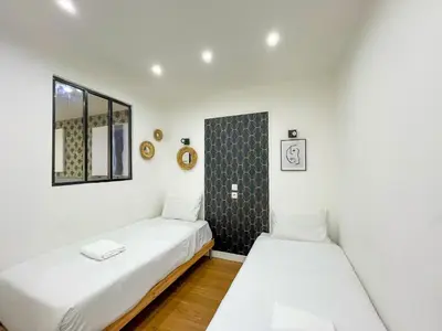 Un ou plusieurs lits dans un hébergement de l'établissement Urban Flat 17 - Pretty 3 Bedroom Flat in Paris