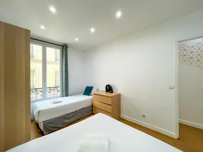 Un ou plusieurs lits dans un hébergement de l'établissement Urban Flat 17 - Pretty 3 Bedroom Flat in Paris