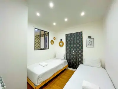 Un ou plusieurs lits dans un hébergement de l'établissement Urban Flat 17 - Pretty 3 Bedroom Flat in Paris