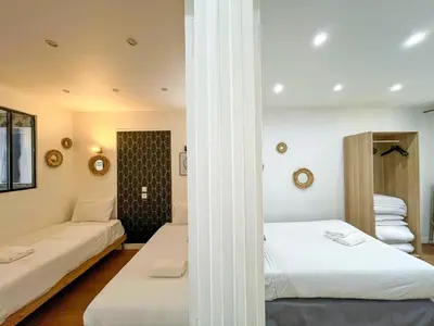 Un ou plusieurs lits dans un hébergement de l'établissement Urban Flat 17 - Pretty 3 Bedroom Flat in Paris