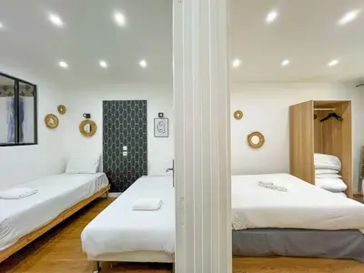 Un ou plusieurs lits dans un hébergement de l'établissement Urban Flat 17 - Pretty 3 Bedroom Flat in Paris