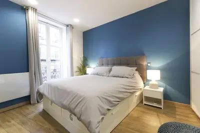 Un ou plusieurs lits dans un hébergement de l'établissement Newly renovated spacious apartment in Montorgeuil area
