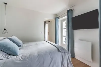 Un ou plusieurs lits dans un hébergement de l'établissement Renovated apartment close to Opera