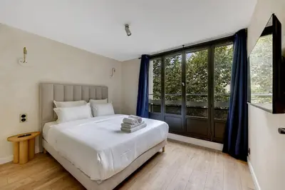 Un ou plusieurs lits dans un hébergement de l'établissement Appartement d'exception à Neuilly Achille Peretti I