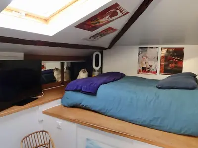 Un ou plusieurs lits dans un hébergement de l'établissement Loft style condo 4 people in central and trendy Paris
