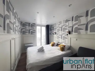 Un ou plusieurs lits dans un hébergement de l'établissement Urban Flat 13 - Pretty 2 Bedroom Parisian Flat