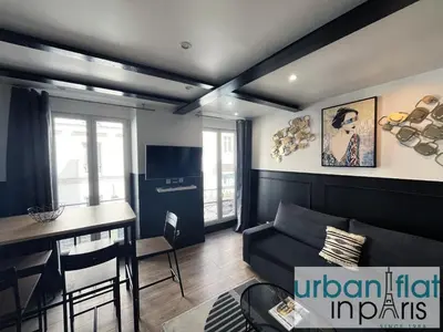 Télévision ou salle de divertissement dans l'établissement Urban Flat 13 - Pretty 2 Bedroom Parisian Flat