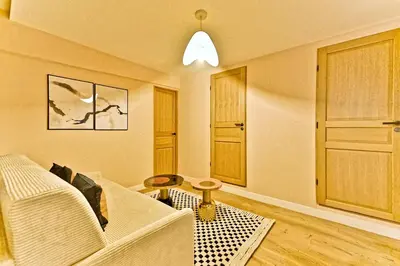 Coin salon dans l'établissement Appartement 3 chambres Paris 2ème - II