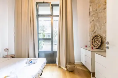 Un ou plusieurs lits dans un hébergement de l'établissement Cœur de Voltaire - Loft cosy Parisien