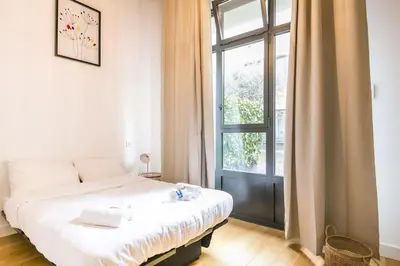 Un ou plusieurs lits dans un hébergement de l'établissement Cœur de Voltaire - Loft cosy Parisien