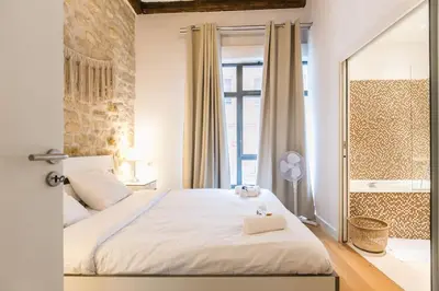 Un ou plusieurs lits dans un hébergement de l'établissement Cœur de Voltaire - Loft cosy Parisien
