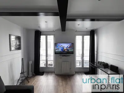 Télévision ou salle de divertissement dans l'établissement Urban Flat 14 - Charming 3 BDR Flat in Paris