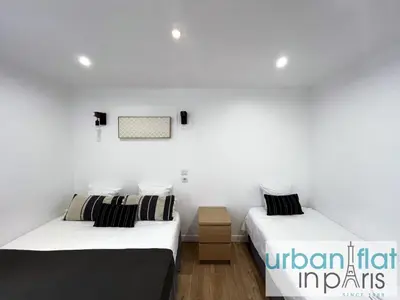 Un ou plusieurs lits dans un hébergement de l'établissement Urban Flat 14 - Charming 3 BDR Flat in Paris