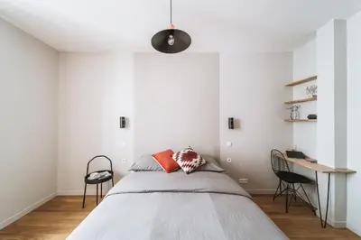 Un ou plusieurs lits dans un hébergement de l'établissement Hotel Particulier 3BDR 8PAX - Jardin du Luxembourg