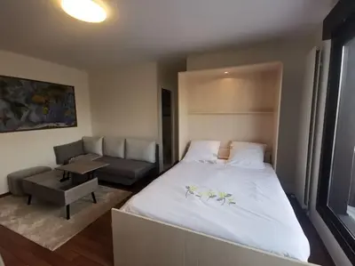 Un ou plusieurs lits dans un hébergement de l'établissement Top floor parisian apartment with terrace