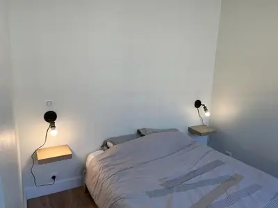Un ou plusieurs lits dans un hébergement de l'établissement Bel appartement Ouest Parisien