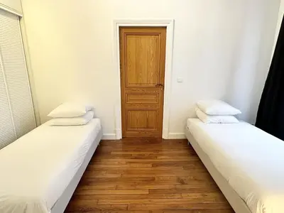Un ou plusieurs lits dans un hébergement de l'établissement Le Marais style APT with 3 bdrs 3 mns Republique N3-43