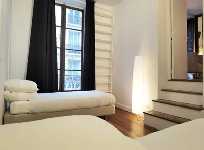 Un ou plusieurs lits dans un hébergement de l'établissement Le Marais style APT with 3 bdrs 3 mns Republique N3-43