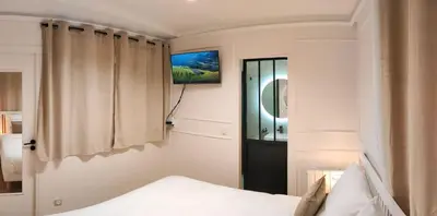 Un ou plusieurs lits dans un hébergement de l'établissement Appartement -Paris Bastille LIGHT