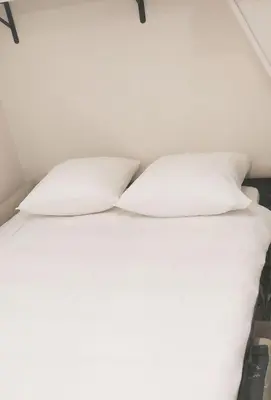 Un ou plusieurs lits dans un hébergement de l'établissement Appartement -Paris Bastille LIGHT