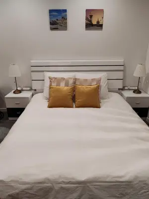 Un ou plusieurs lits dans un hébergement de l'établissement appartement champs elysees
