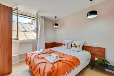 Un ou plusieurs lits dans un hébergement de l'établissement Bluestay 86 - Charmant appartement Paris 13