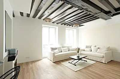 Coin salon dans l'établissement Stylish Two-Bedroom Apartment in Saint-Germain