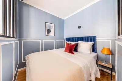 Un ou plusieurs lits dans un hébergement de l'établissement Suite Notre Dame 1 Bedroom