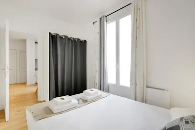 Un ou plusieurs lits dans un hébergement de l'établissement Séjour parisien pour 4, près de Montmartre