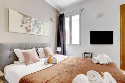 Un ou plusieurs lits dans un hébergement de l'établissement Bluestay 273 - Charmant Studio à Paris