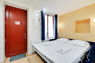 Un ou plusieurs lits dans un hébergement de l'établissement Appartement neuf au coeur de Paris