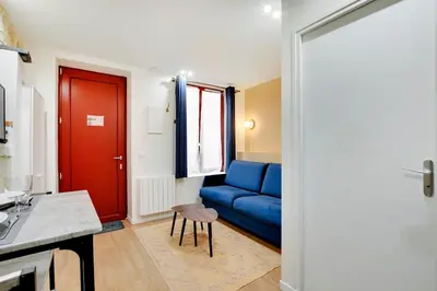 Coin salon dans l'établissement Appartement neuf au coeur de Paris