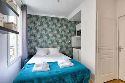 Un ou plusieurs lits dans un hébergement de l'établissement Bluestay 176 - Superbe Appartement à Paris