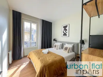 Un ou plusieurs lits dans un hébergement de l'établissement Urban Flat 119 - Spacious 5 Bedroom Flat in Paris
