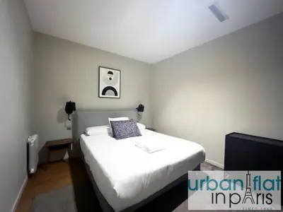 Un ou plusieurs lits dans un hébergement de l'établissement Urban Flat 119 - Spacious 5 Bedroom Flat in Paris
