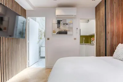 Un ou plusieurs lits dans un hébergement de l'établissement Charming Pied à Terre near Montmartre