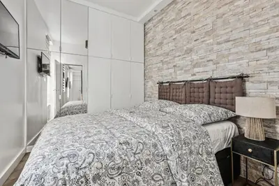 Un ou plusieurs lits dans un hébergement de l'établissement 03 Tour Eiffel Appartement pour 7 personnes