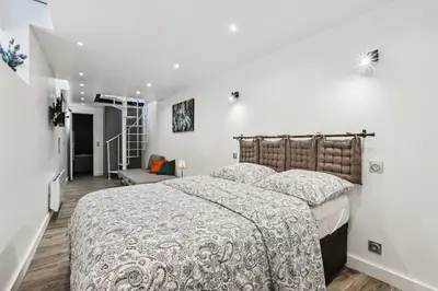 Un ou plusieurs lits dans un hébergement de l'établissement 03 Tour Eiffel Appartement pour 7 personnes