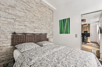 Un ou plusieurs lits dans un hébergement de l'établissement 03 Tour Eiffel Appartement pour 7 personnes