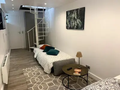 Un ou plusieurs lits dans un hébergement de l'établissement 03 Tour Eiffel Appartement pour 7 personnes