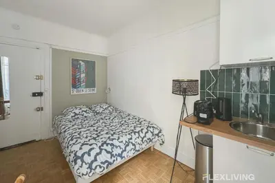 Un ou plusieurs lits dans un hébergement de l'établissement Flexliving - Studio - Championnet