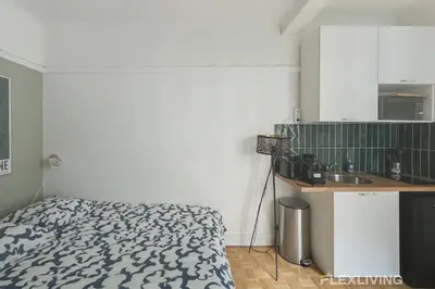 Cuisine ou kitchenette dans l'établissement Flexliving - Studio - Championnet