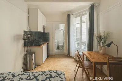 Cuisine ou kitchenette dans l'établissement Flexliving - Studio - Championnet