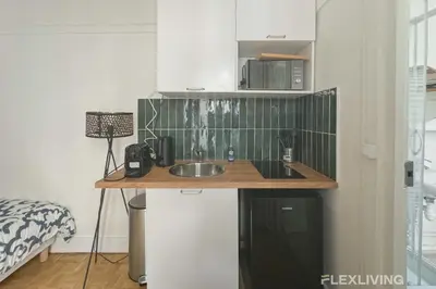 Cuisine ou kitchenette dans l'établissement Flexliving - Studio - Championnet
