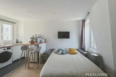Un ou plusieurs lits dans un hébergement de l'établissement Flexliving - studio - Legendre