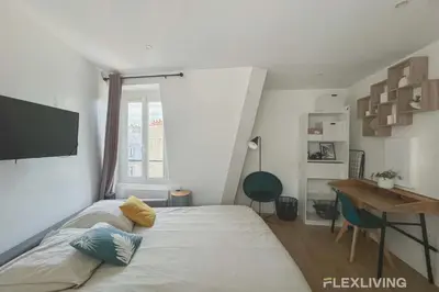 Un ou plusieurs lits dans un hébergement de l'établissement Flexliving - studio - Legendre