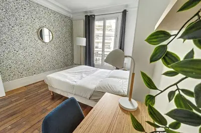 Un ou plusieurs lits dans un hébergement de l'établissement chambre dans T3 élégant et charmant proche du bois de Vincennes